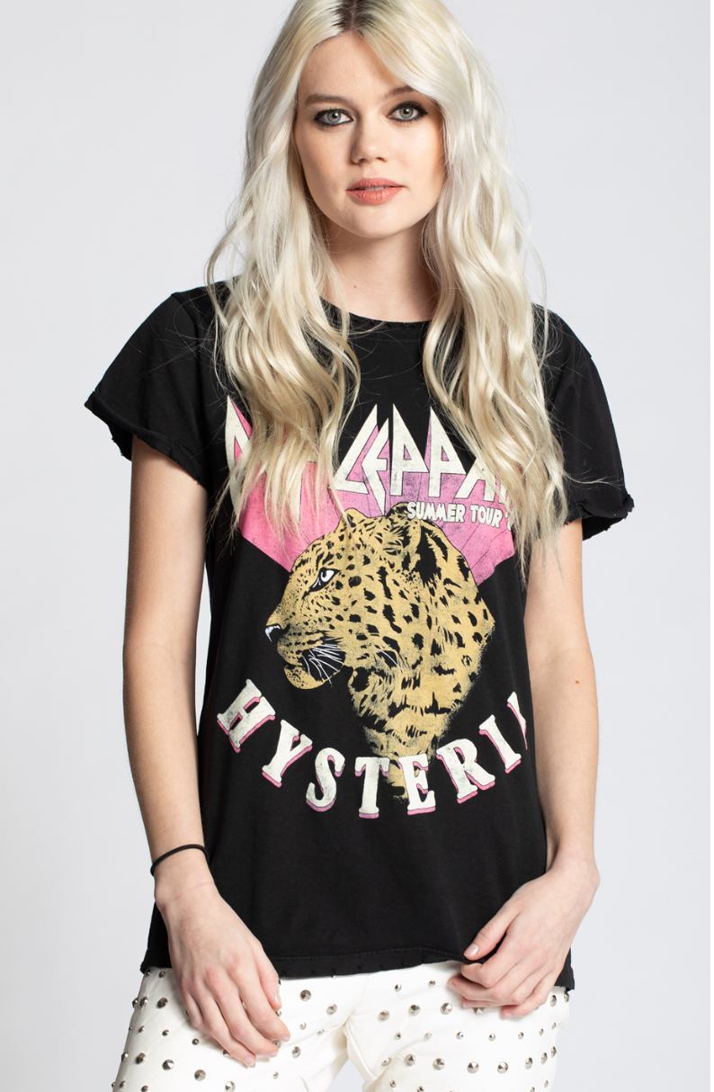 Woman wearing a black t-shirt with a leopard graphic and text on a white background