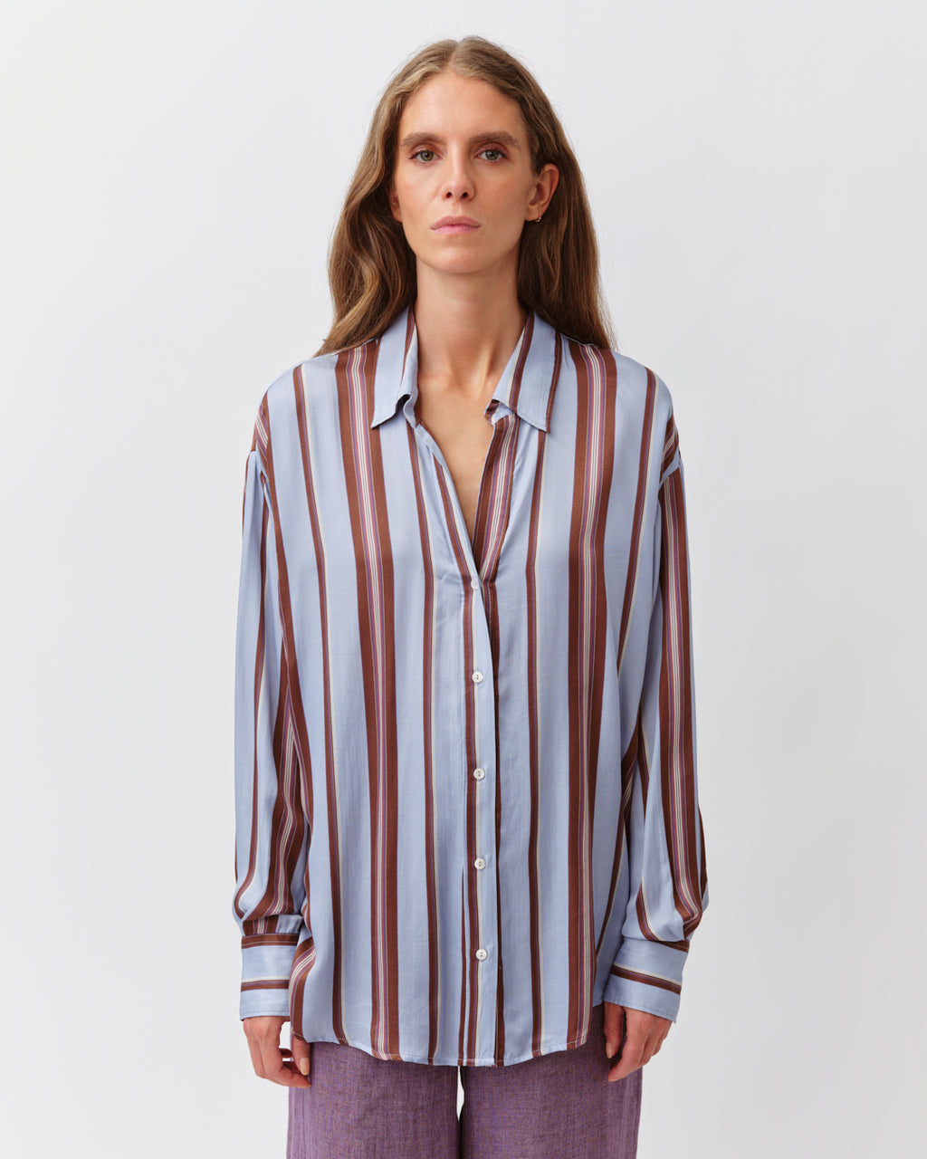Woman wearing a striped shirt on a white background