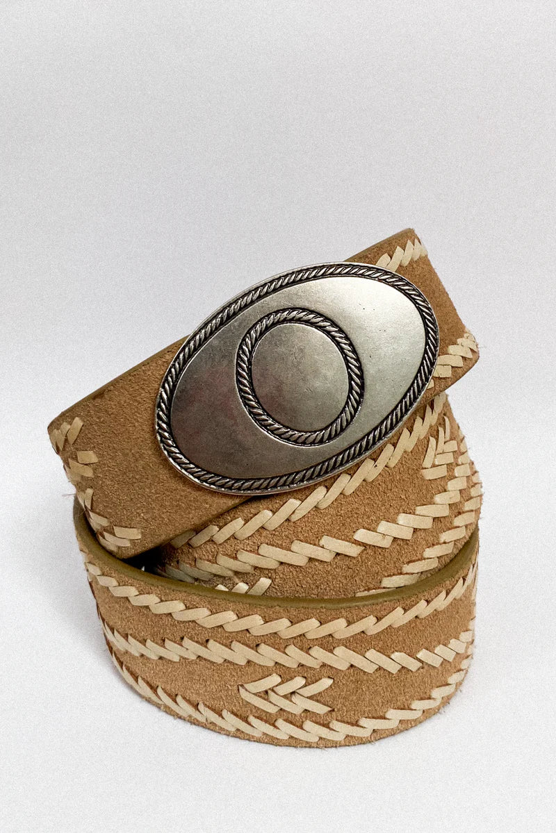 Belt with braided design and metallic buckle on a white background