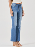 Blue jeans worn by a person on a white background