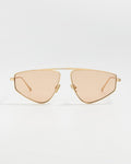 elisa johnson Gold-framed sunglasses with beige lenses on a light gray background