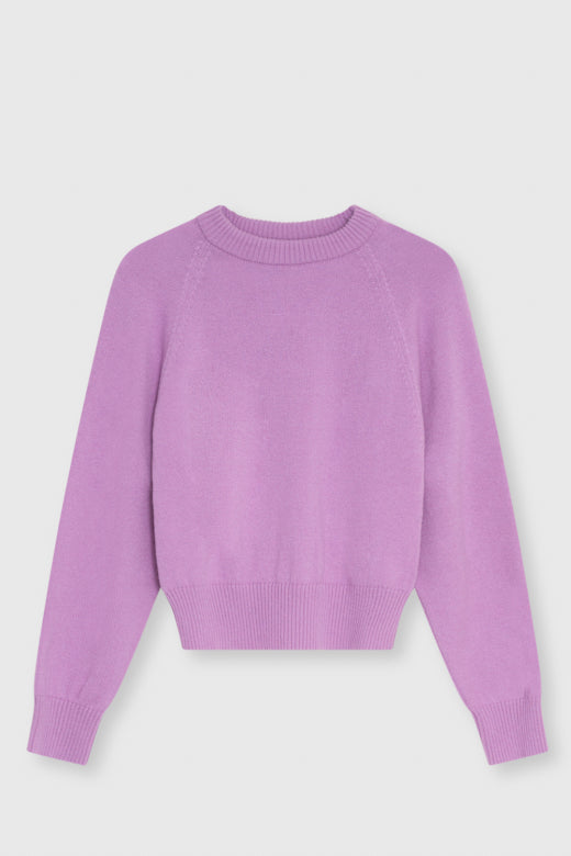 A light purple knit crewneck sweater with raglan sleeves, displayed flat against a light gray background.